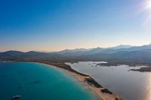 AERIAL ART - view along La Cinta beach and mountains in thhe back - Sardinia - Italy AERIAL ART - view along La Cinta beach and mountains in thhe back - Sardinia - Italy.jpg