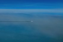 Aircraft in flight with dark vapor trail Aircraft in flight with dark vapor trail.jpg