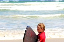 SURFER WITH BOARD - MUIZENBERG - SOUTH AFRICA 02 SURFER WITH BOARD - MUIZENBERG - SOUTH AFRICA 02